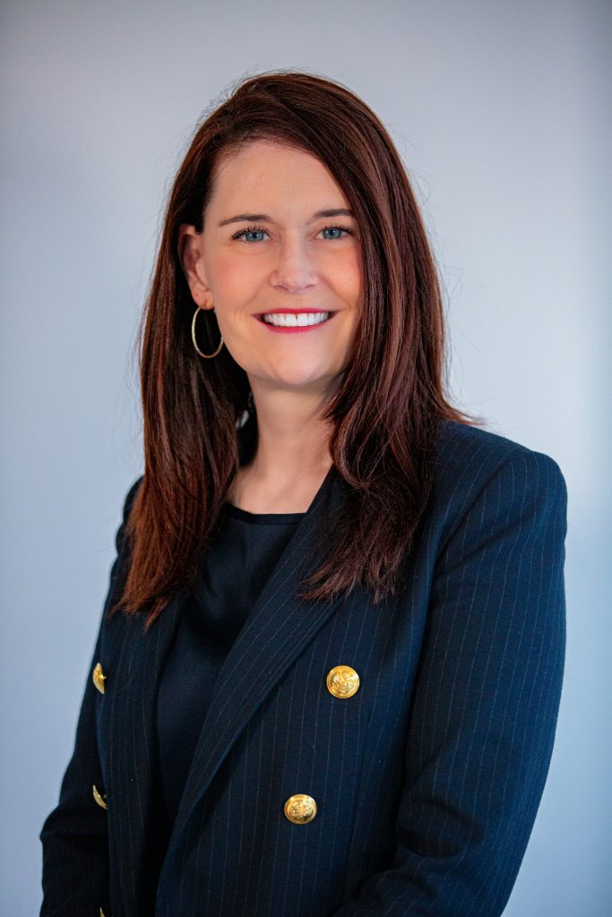 a square photo of AnnMarie Killian, a smiling woman with mid-length hair and a navy blazer