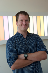 a photo of Jeff Shaul, a smiling man with brown hair in a blue shirt